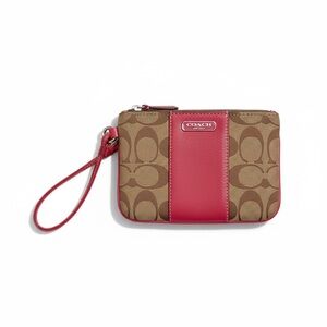 Coach Blocked Signature Canvas Small Wristlet Clutch in a pink & tan color way.